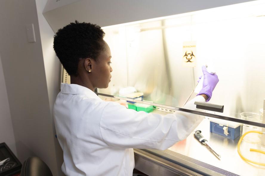 Scientist looking at research and laboratory equipment