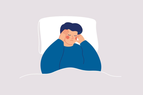 Illustration of a man having trouble sleeping in bed