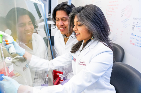 Nisha Iyer, Assistant Professor of Biomedical Engineering, and a male student in PhD prgram in Biomedical Engineering, pose for a portrait 